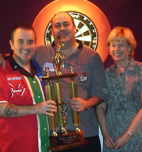 TAYLOR TAKES WORLD DARTS TROPHY